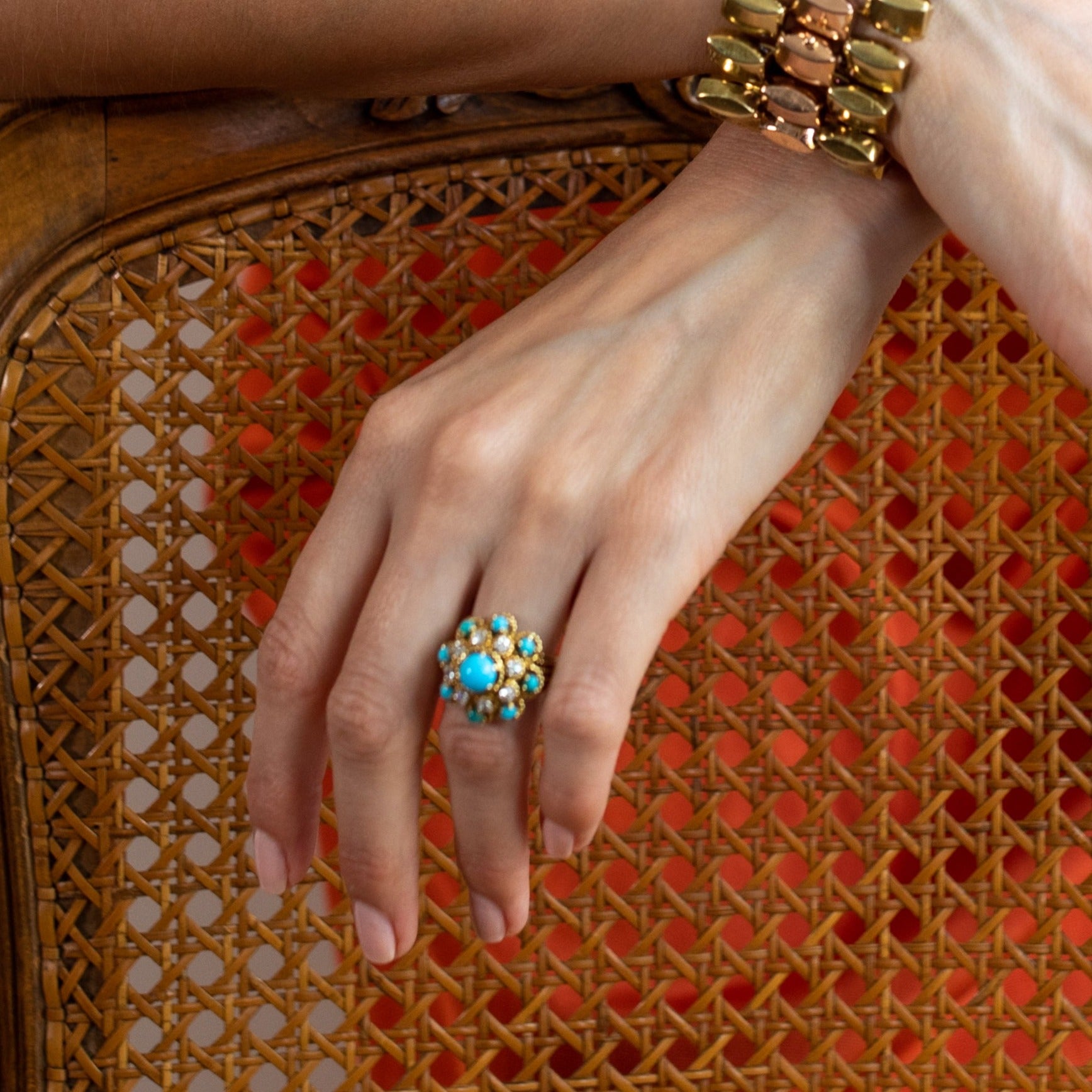 Vintage 1970s turquoise ring worn on woman’s hand. 