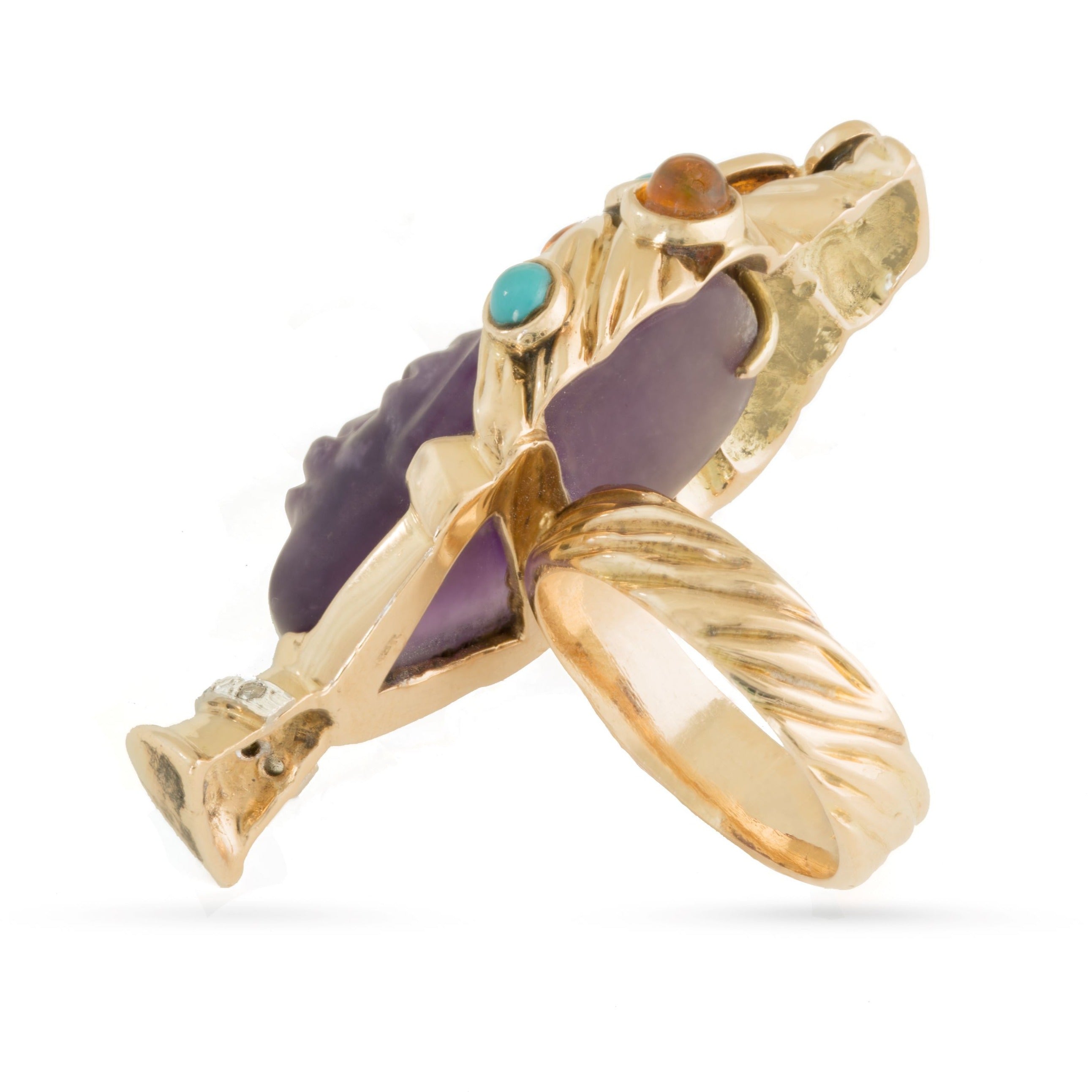 Side view of 18ct gold gemstone ring.