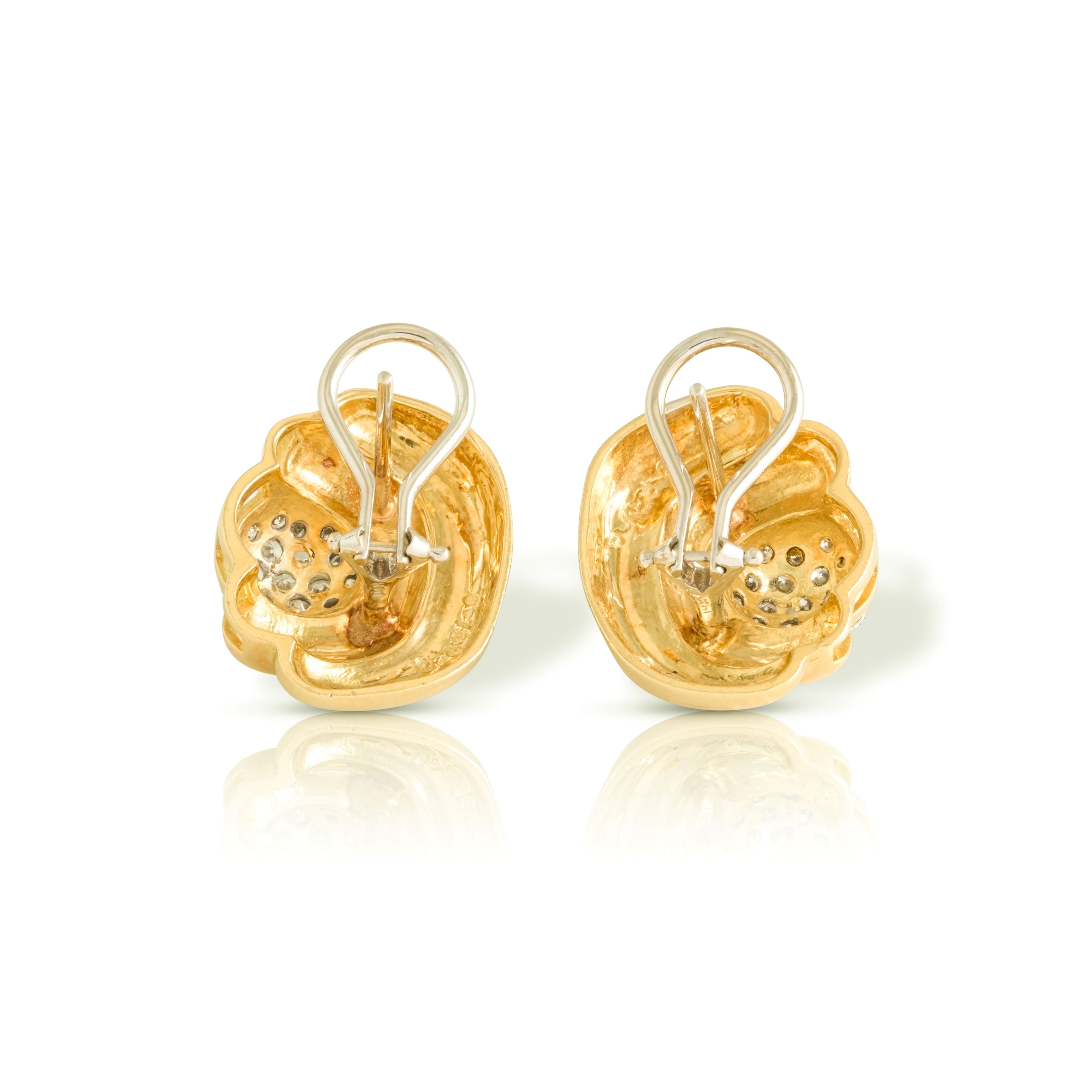 Omega closures on vintage gold earrings.