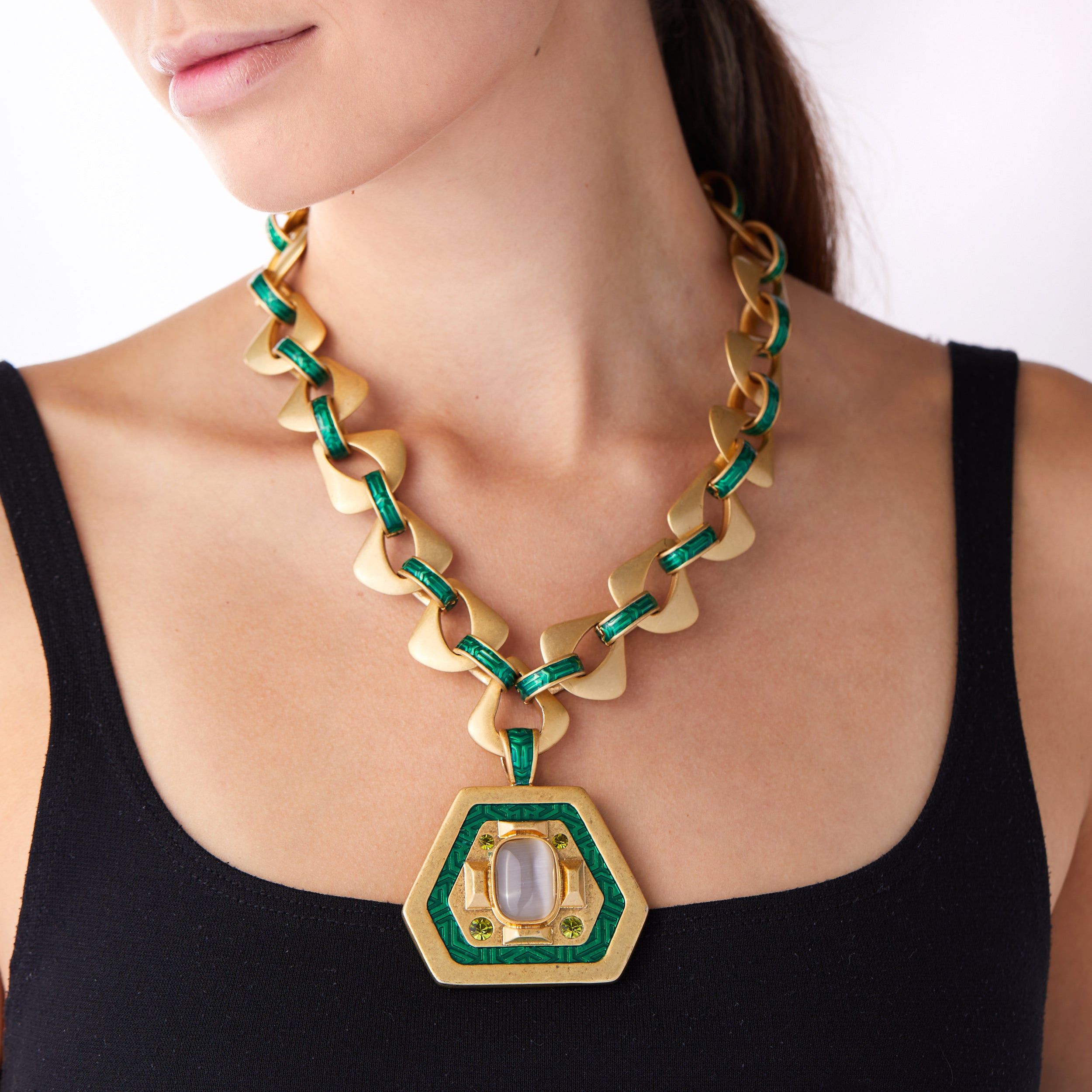 Woman wearing a vintage medallion pendant necklace