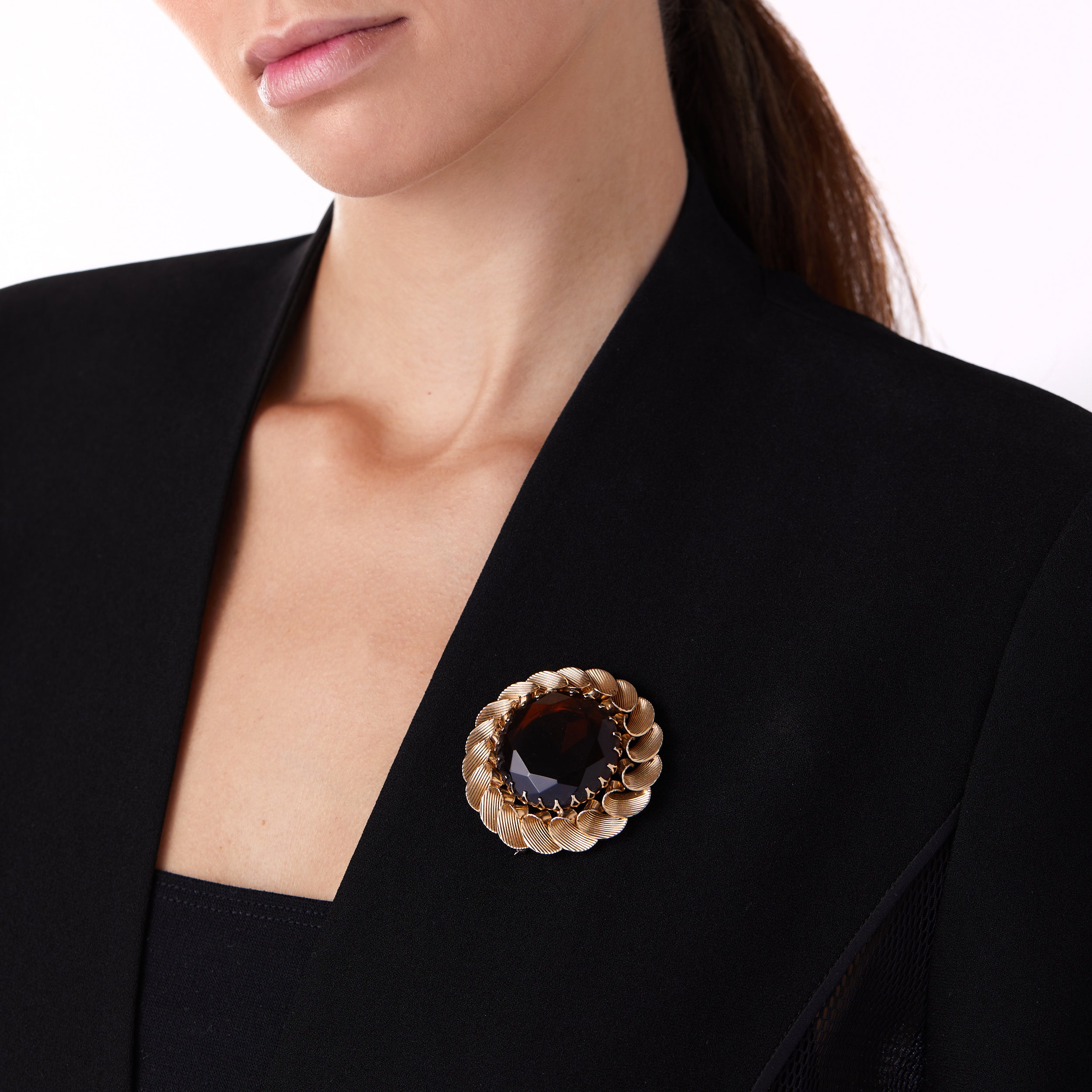 Vintage Marvella wreath pin brooch worn on a blazer lapel