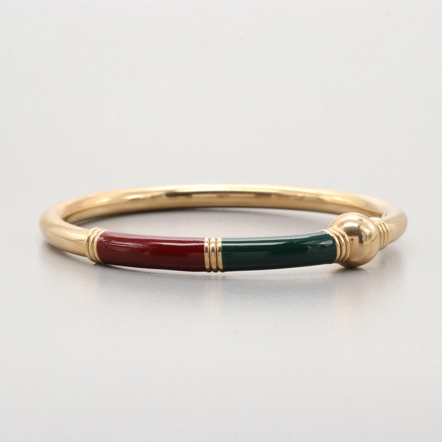 Italian 14ct single gold bangle with dark red and green enamel.