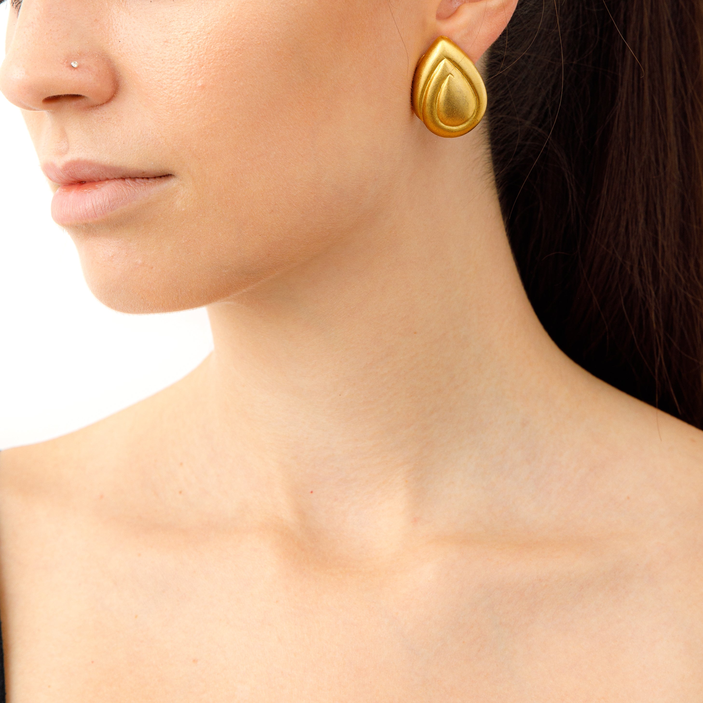 Vintage washed gold teardrops earrings on model