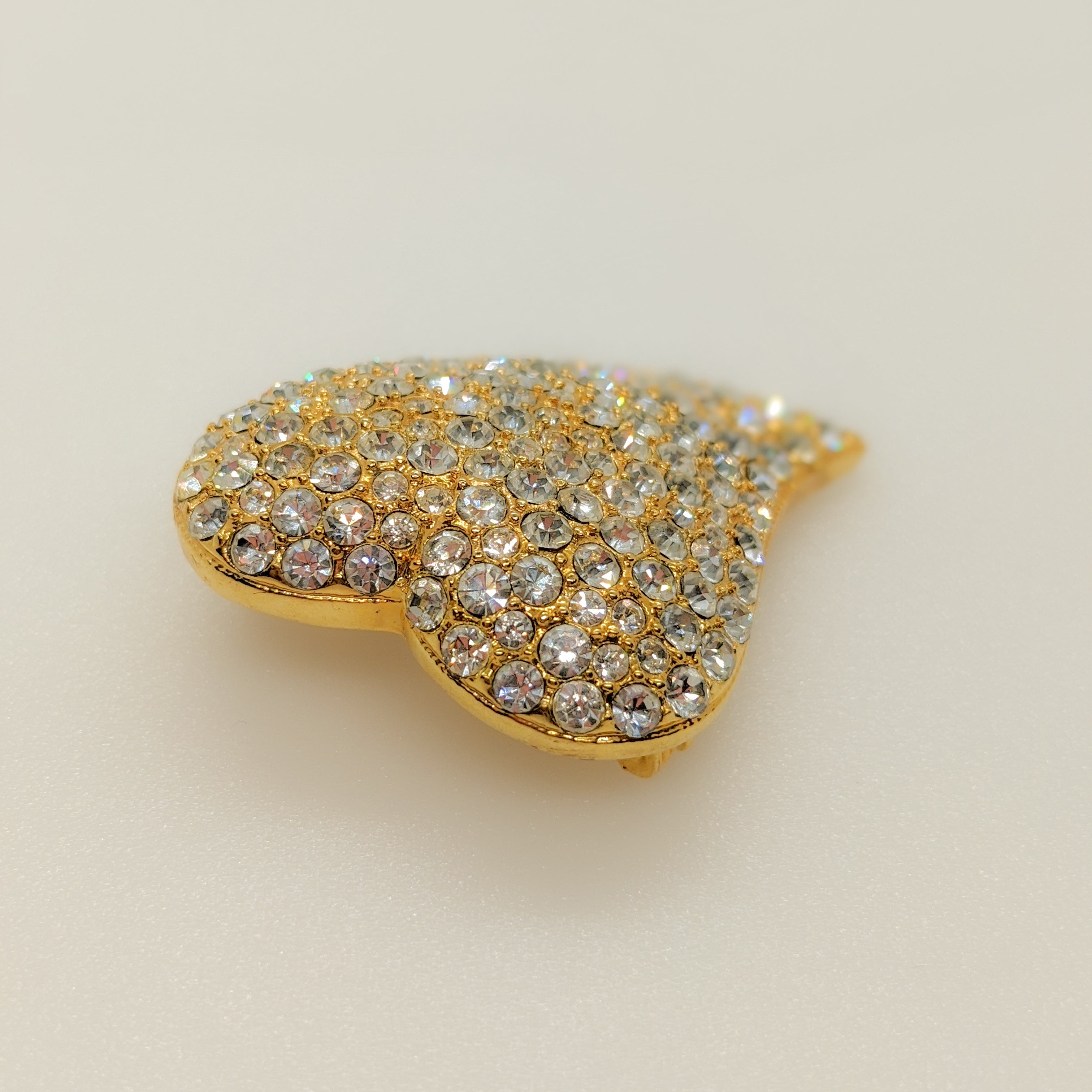 Side view of vintage heart brooch pin with rhinestones