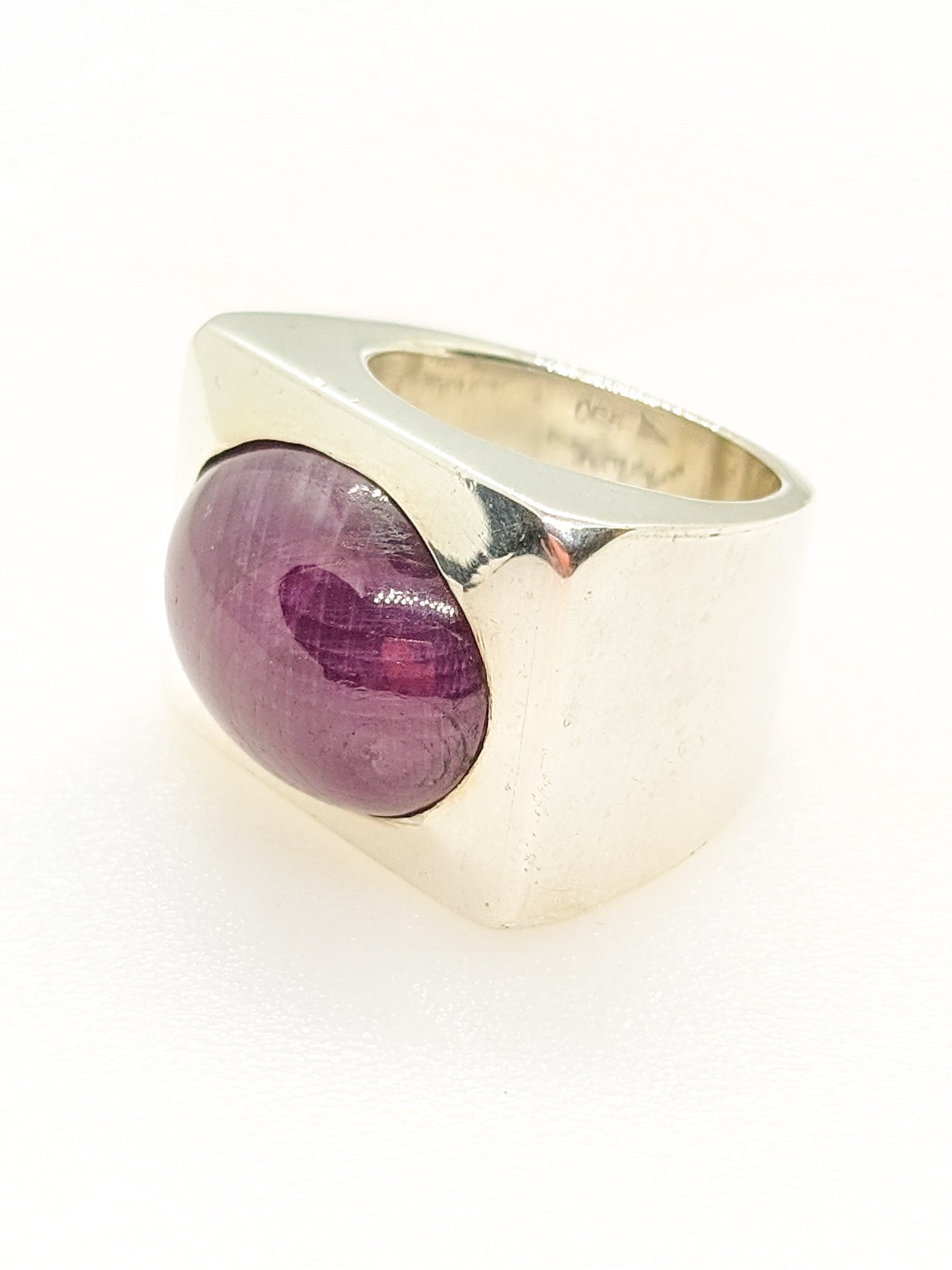 Silver chunky ring with purple corundum from the 2000s.