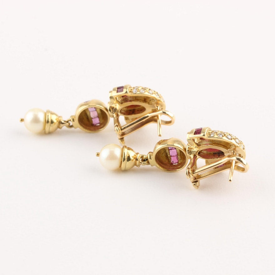 Omega closure on vintage gold dangle earrings.