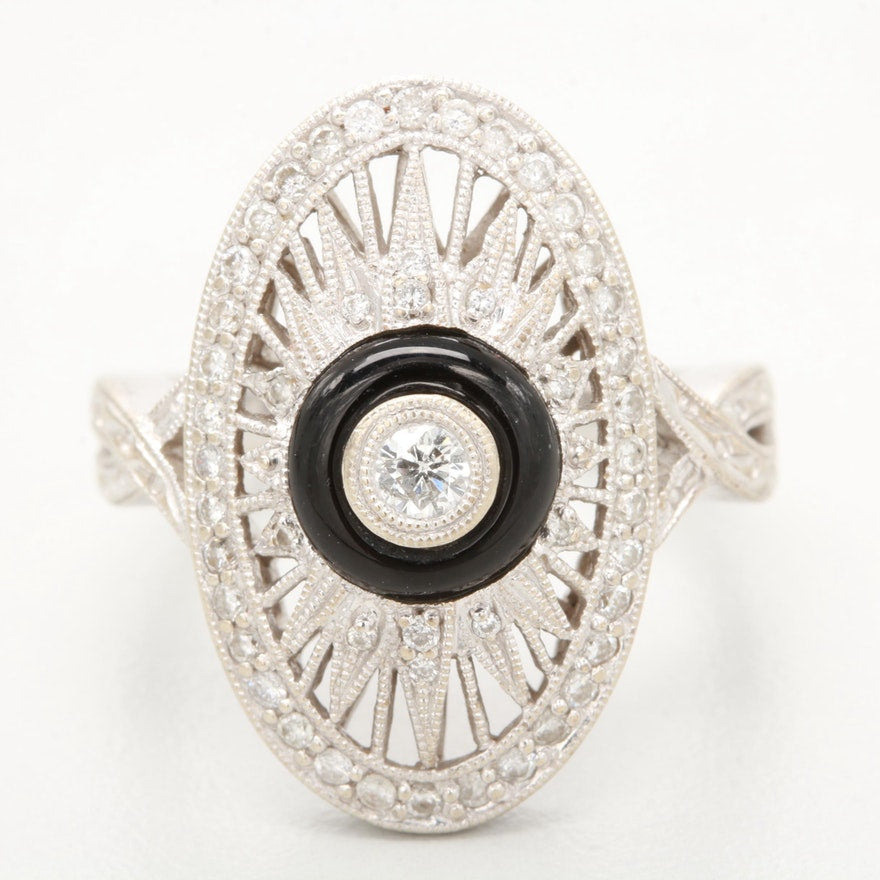Art Deco-style white gold diamond ring with a black onyx centre.