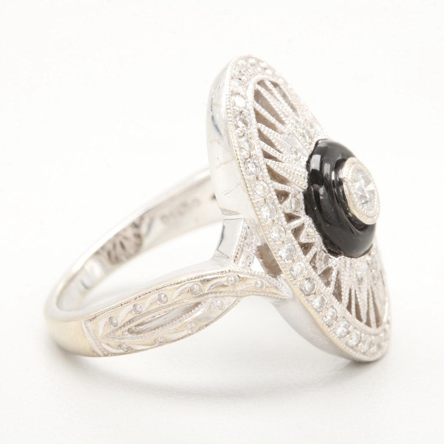 Side view of vintage white gold diamond and onyx ring.