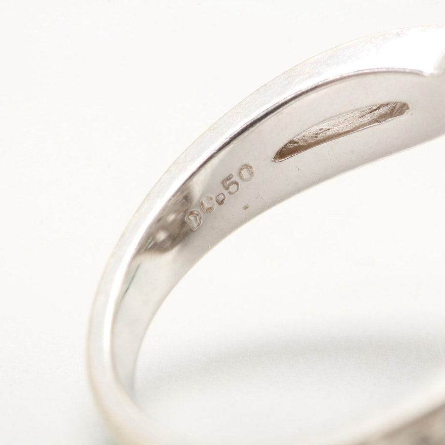  Hallmark on vintage white gold diamond ring reading ‘D0.50’.
