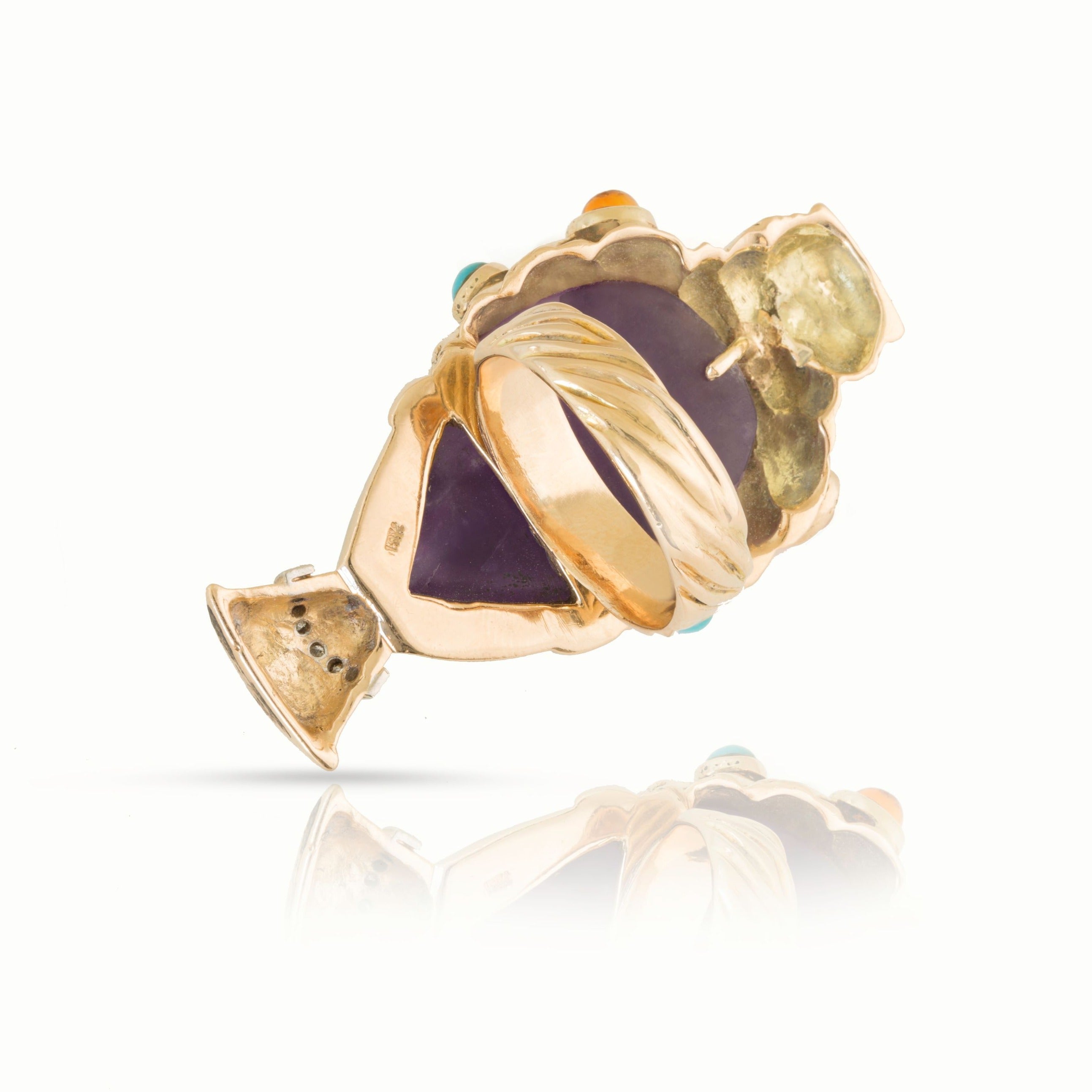 Vintage gold amethyst ring in tilted view. 