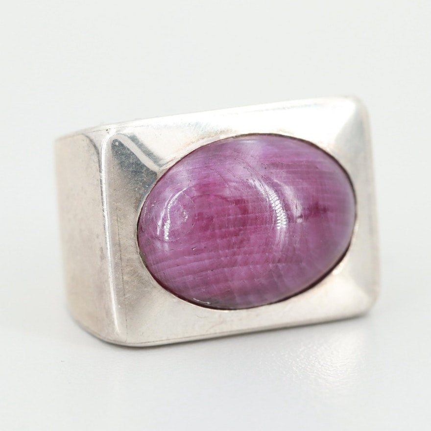 Silver chunky ring with purple corundum stone. 