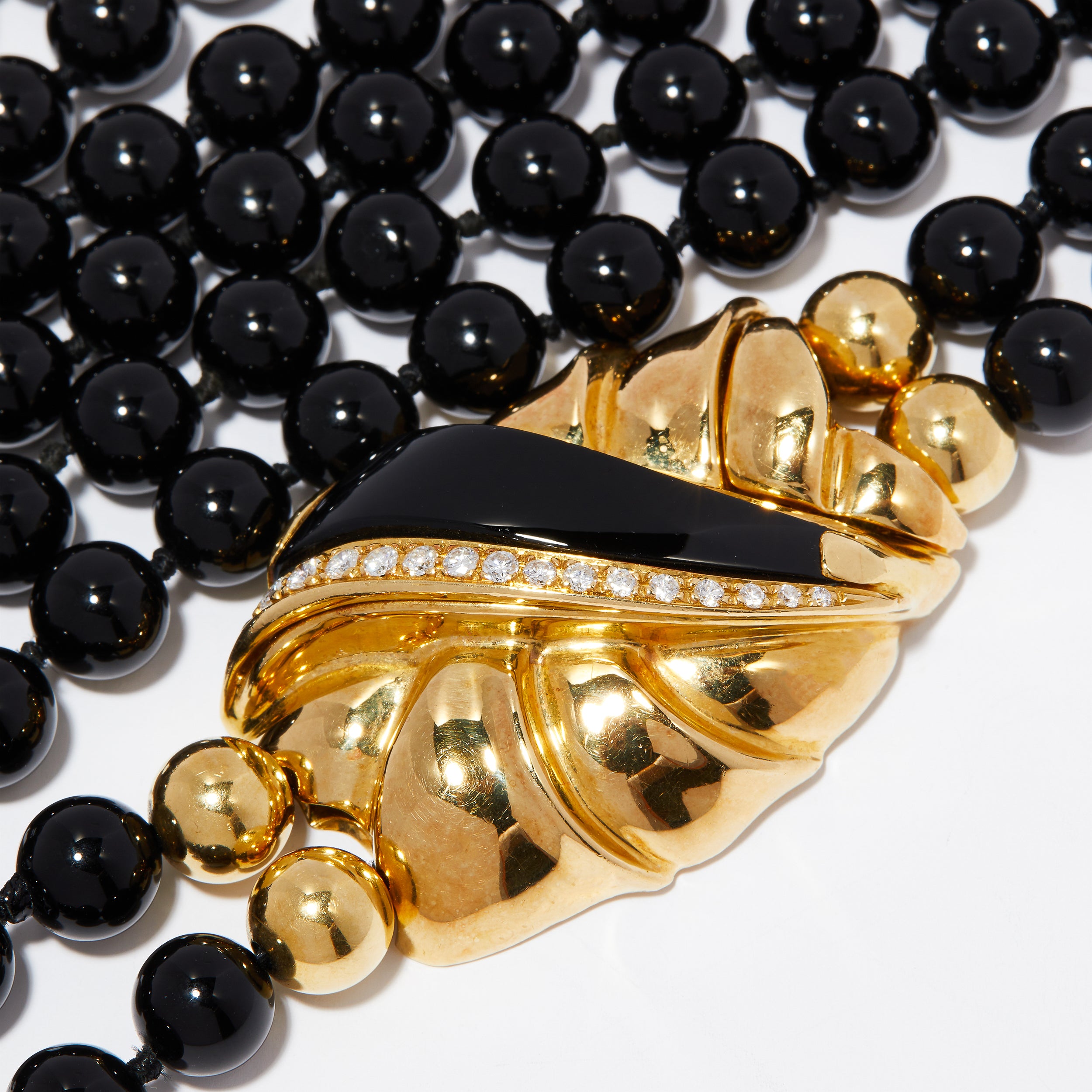 18ct gold and diamond clasp on vintage black onyx necklace.