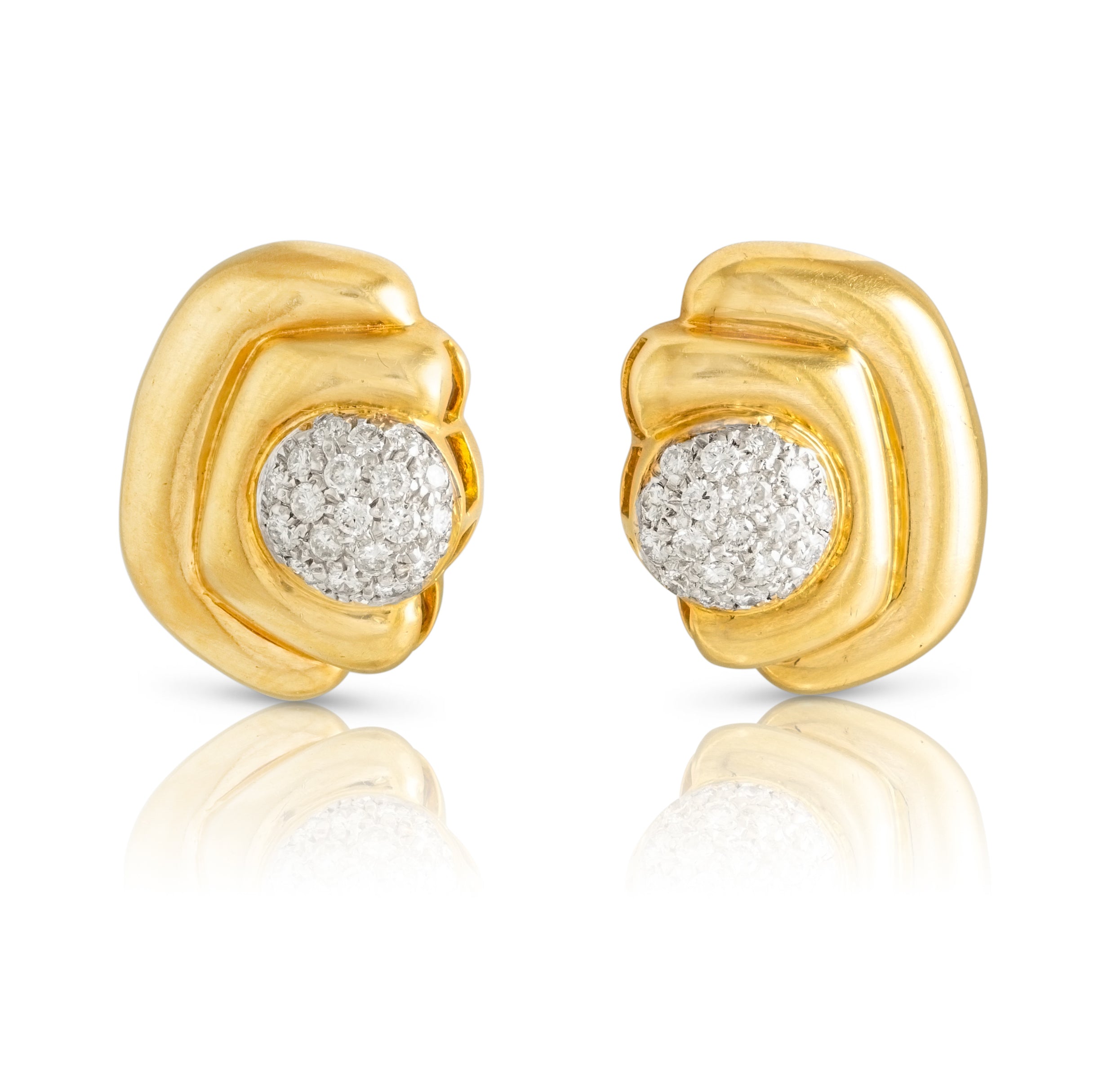 Gold drop earrings in bracket design and diamond centres.