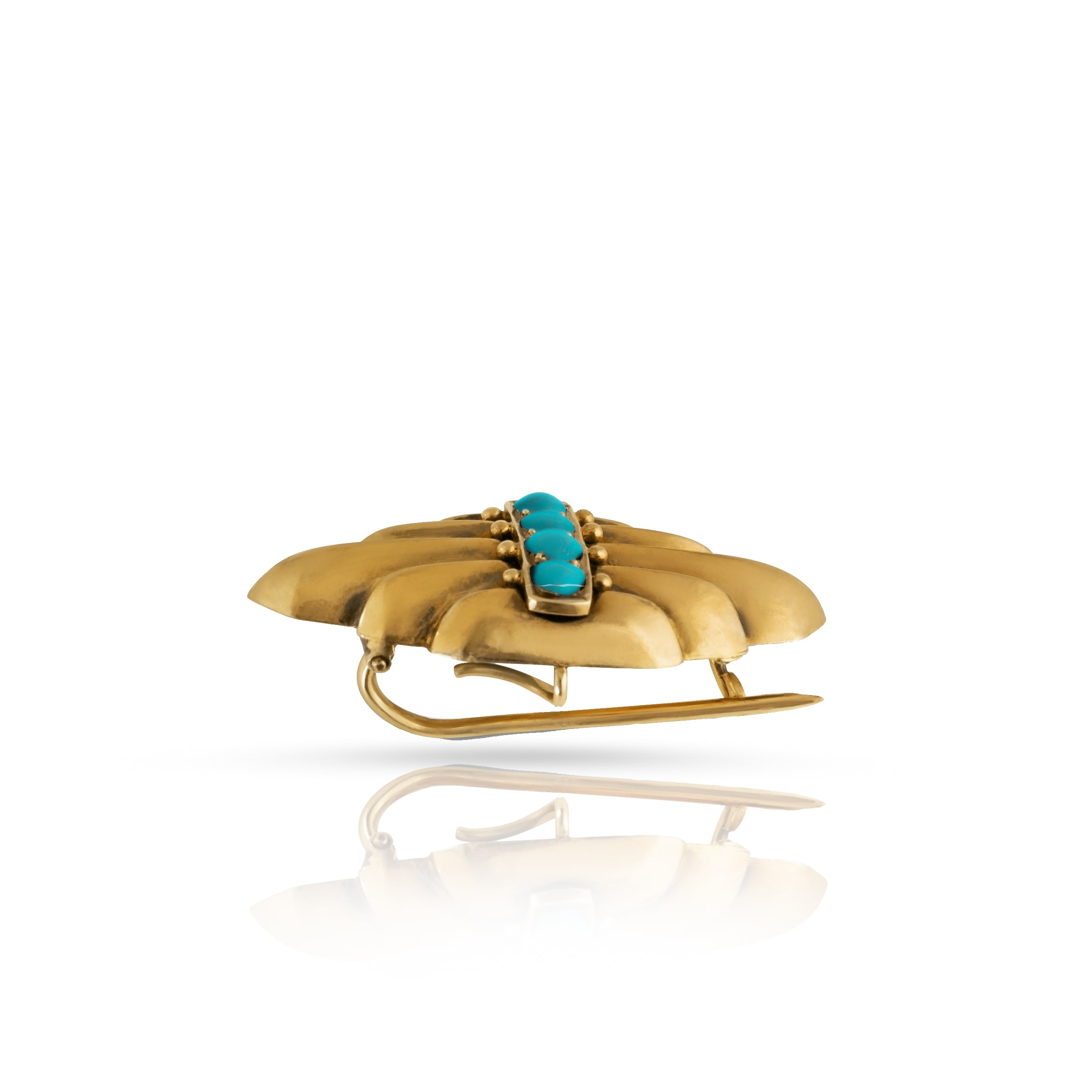 Side view of gold and turquoise brooch.
