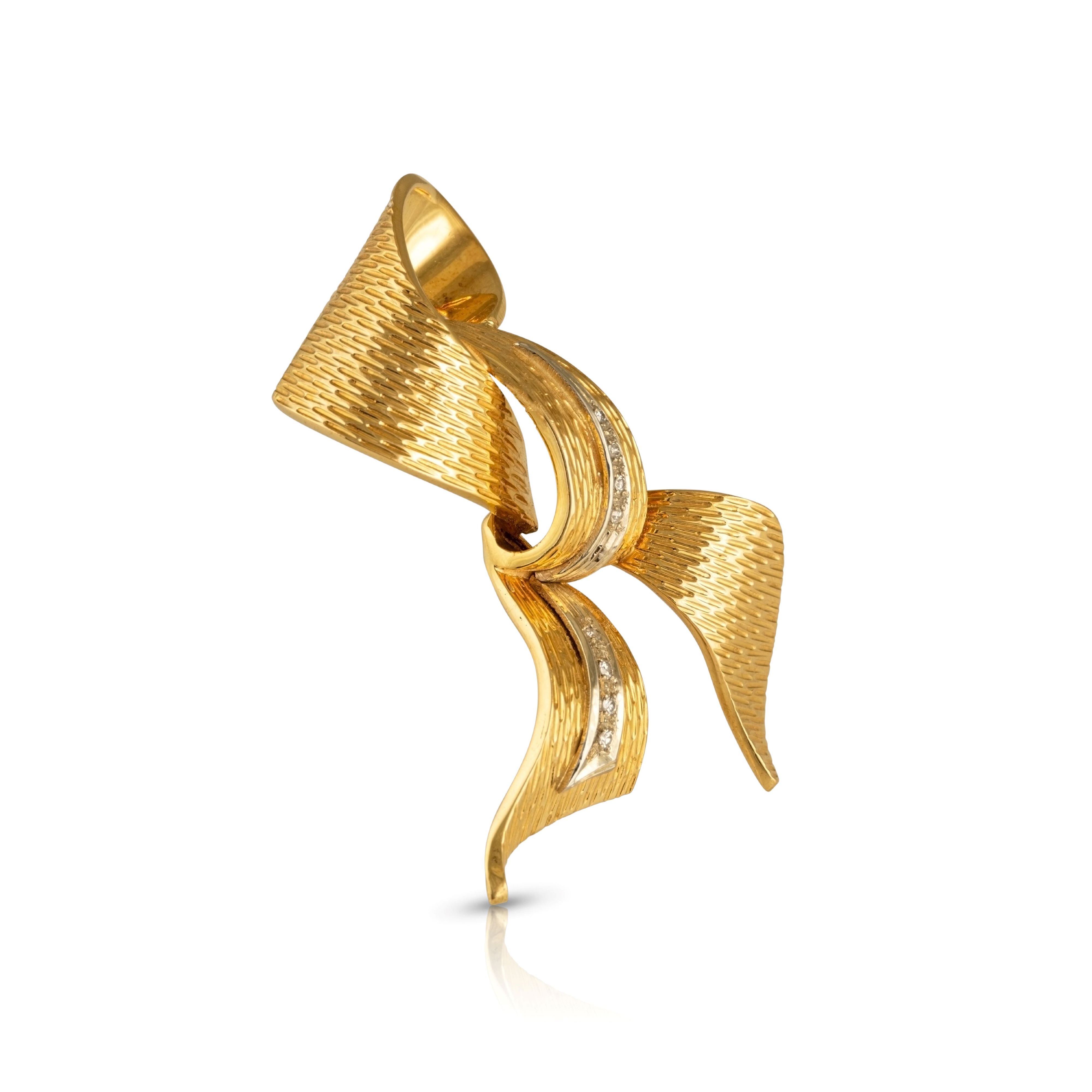 Tilted view of 1960s gold and diamond brooch