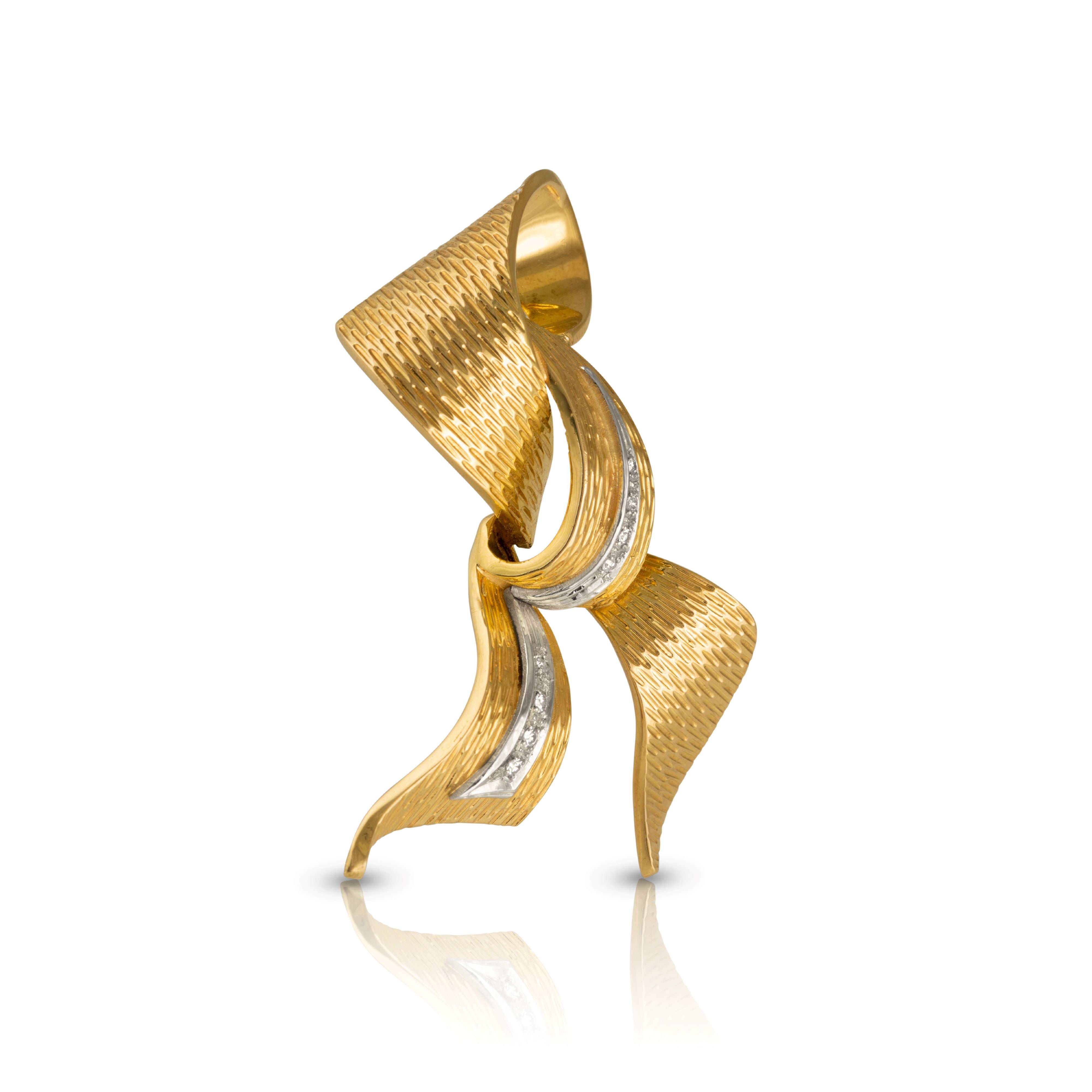 Side view of vintage gold brooch with diamonds.