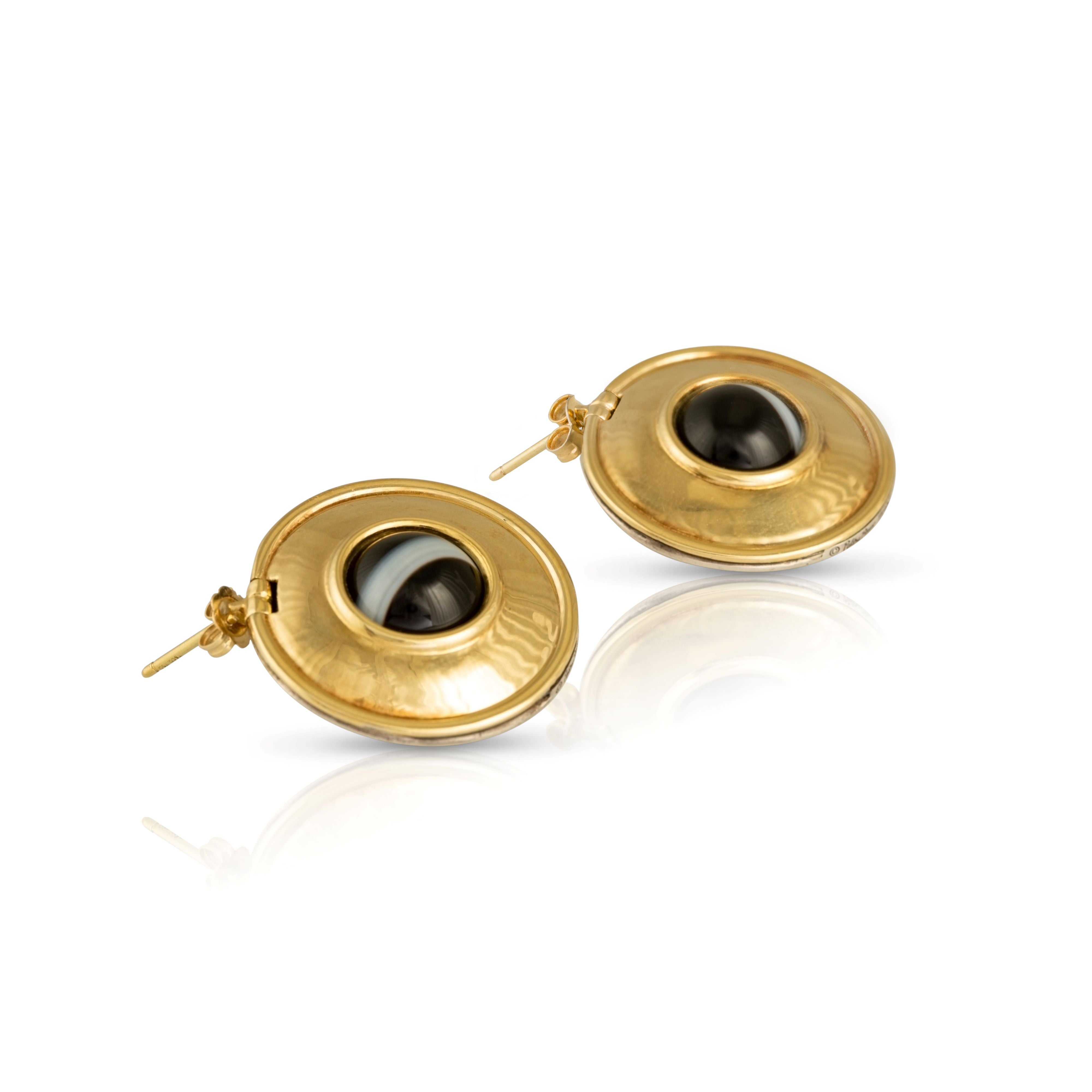 Vintage Paloma Picasso gold and silver earrings with bull’s eye agate stone.