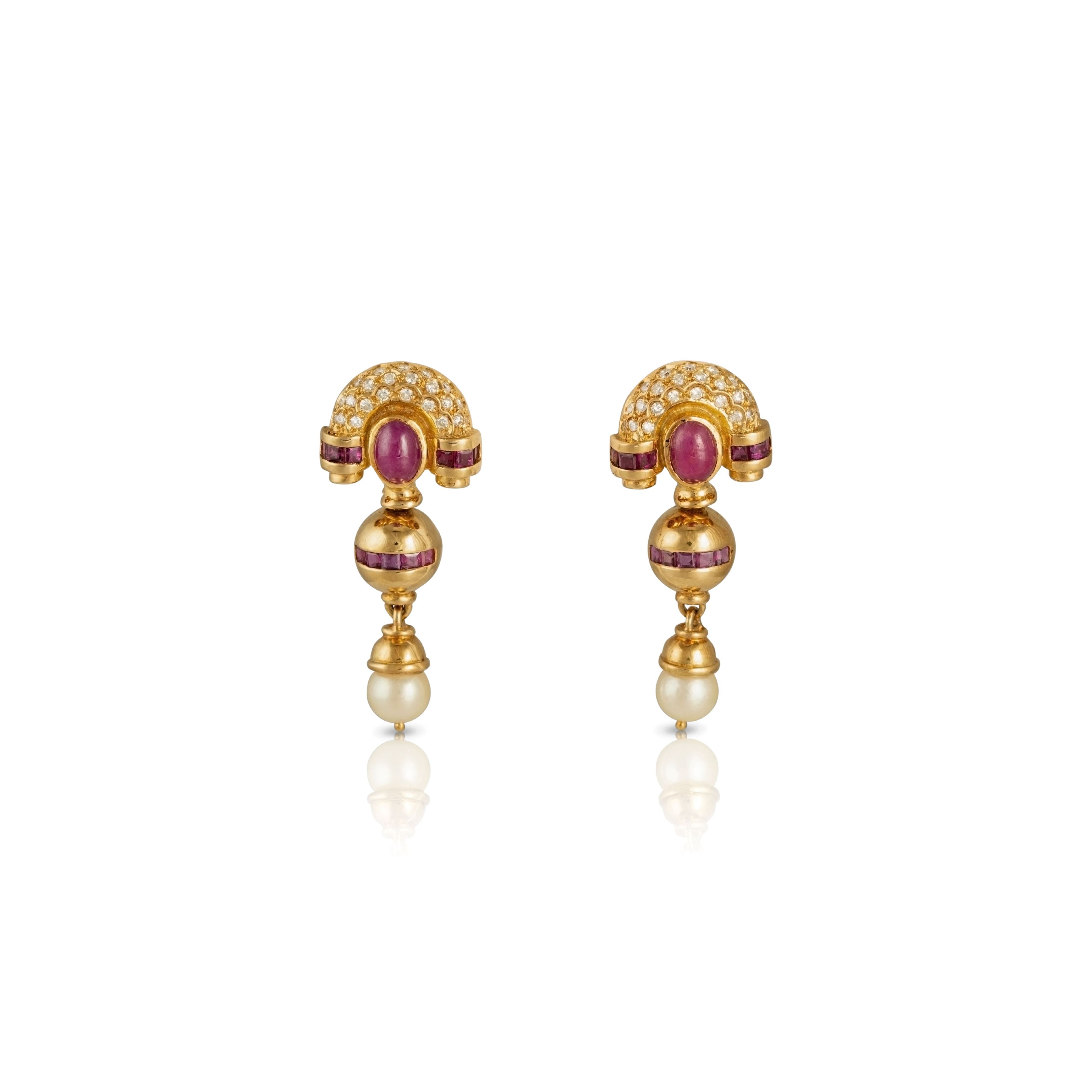 Pearl dangle earrings in 18ct gold with rubies and diamonds.
