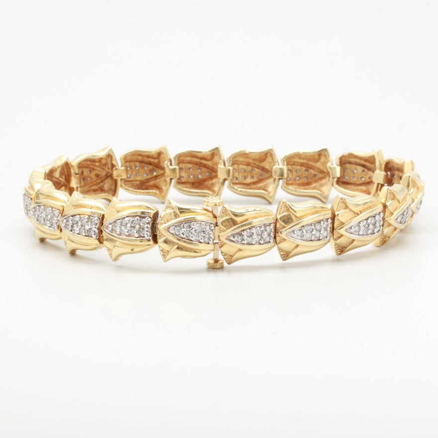 Vintage gold diamond bracelet in 14ct gold lotus flower motif.