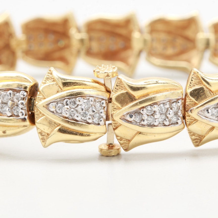 Box-tab-insert closure on estate gold and diamond lotus bracelet.