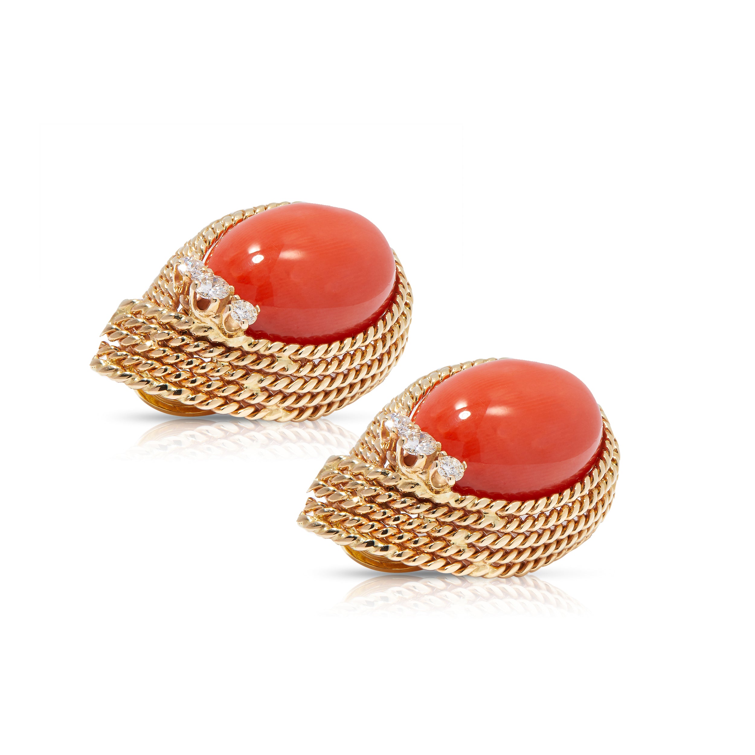 Side view of contemporary fine earrings with gold rope twist and corals