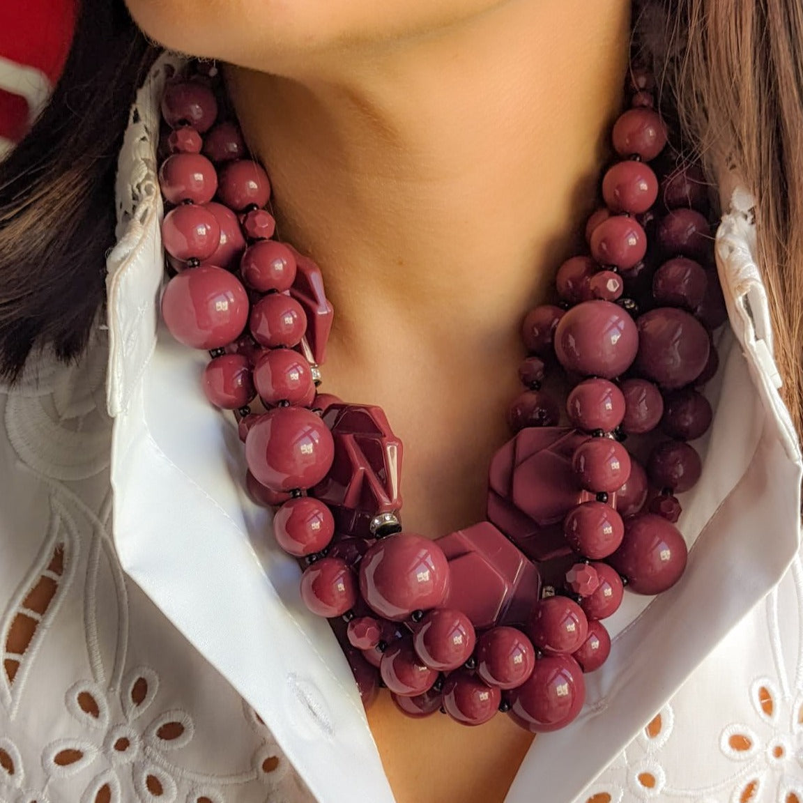 Vintage Angela Caputi plastic beaded necklace worn on woman’s neck