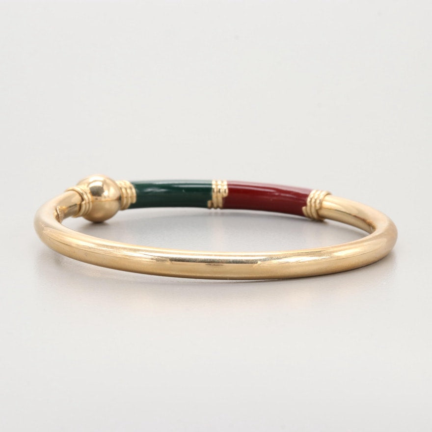 Hallmarks on vintage gold bangle bracelet reading ‘RZN 14Kt ITALY’.