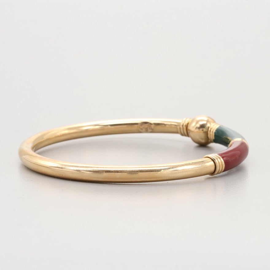 Vintage round single gold bangle with enamel and custom ball closure.