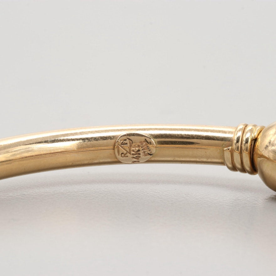 Hallmarks on vintage gold bangle bracelet reading ‘RZN 14Kt ITALY’.