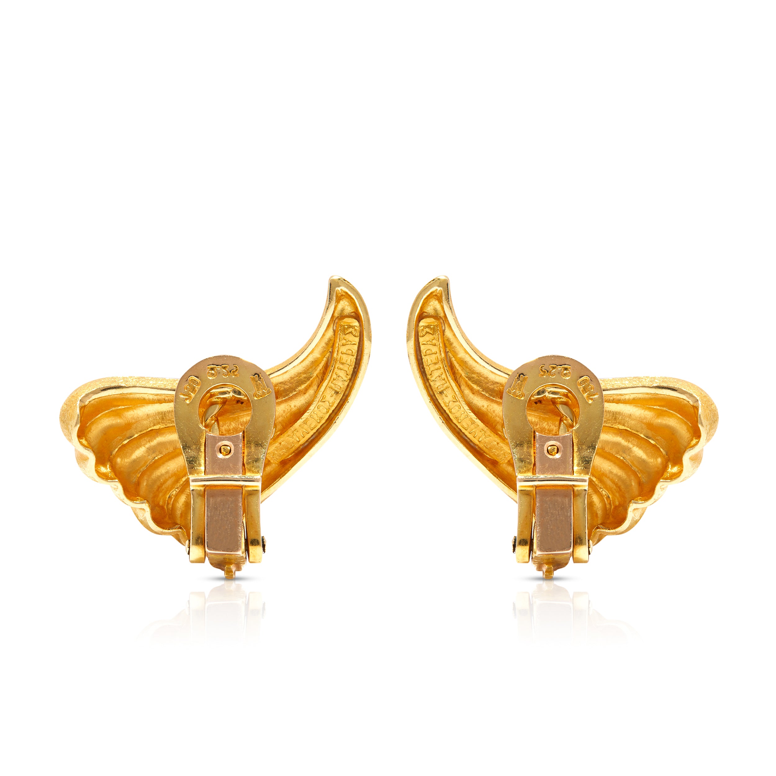 Clip-on closure on vintage signed 18ct gold earrings.