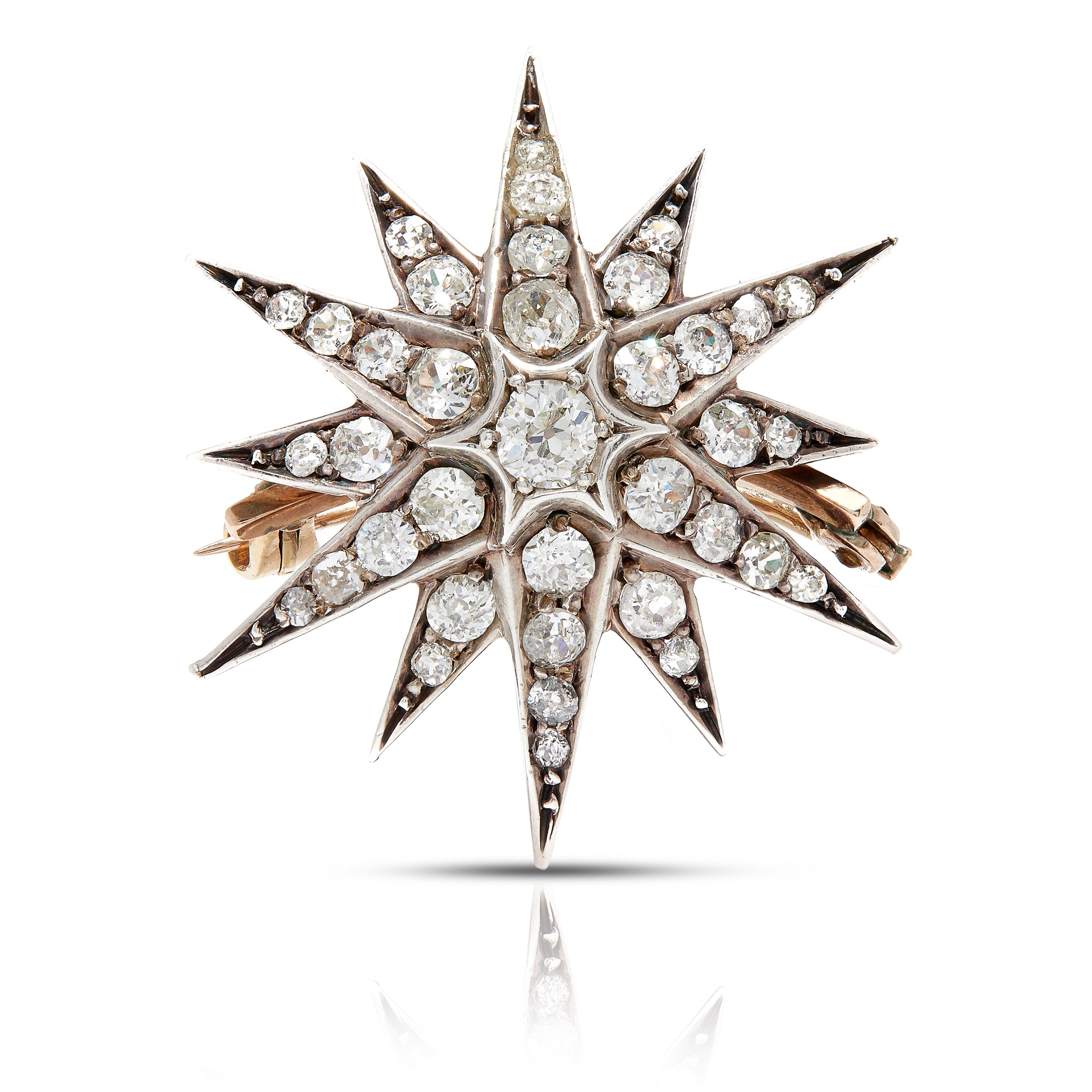 Antique diamond brooch in a starburst motif.