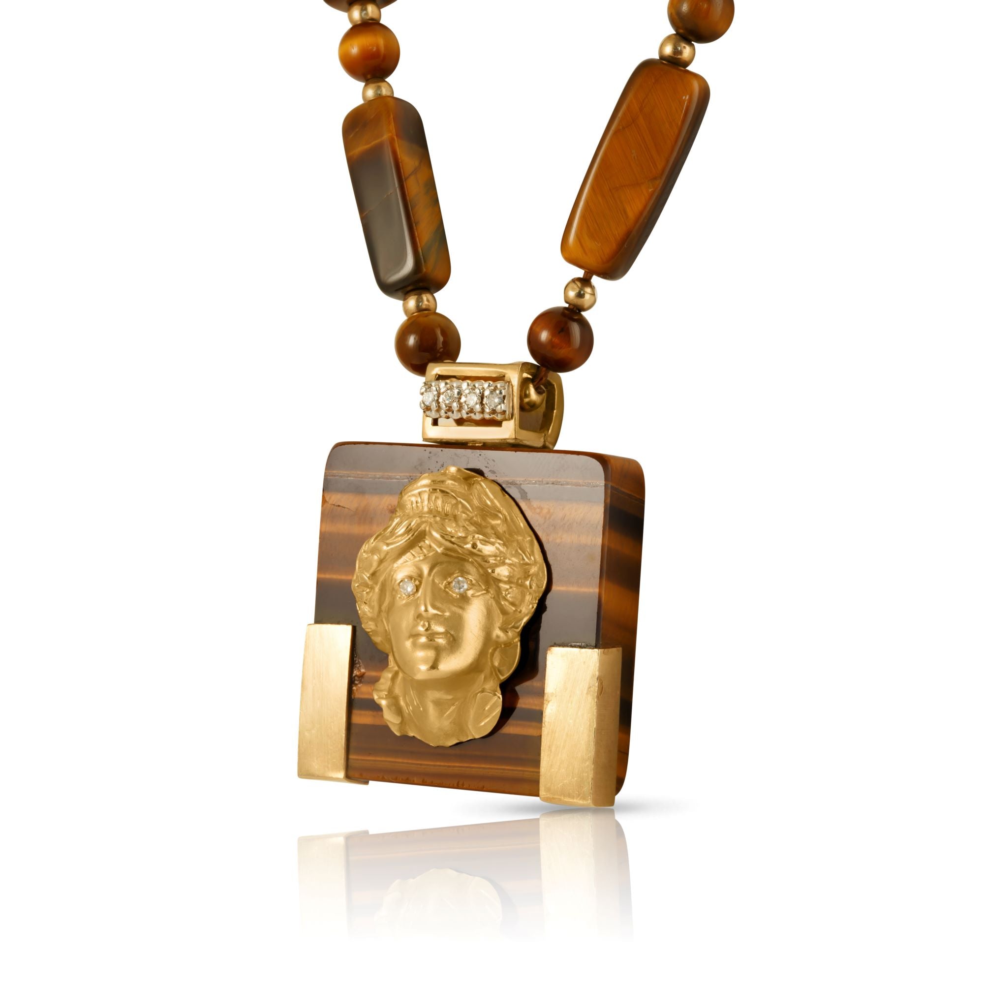 Tiger’s eye necklace with articulated gold female portrait and diamonds.